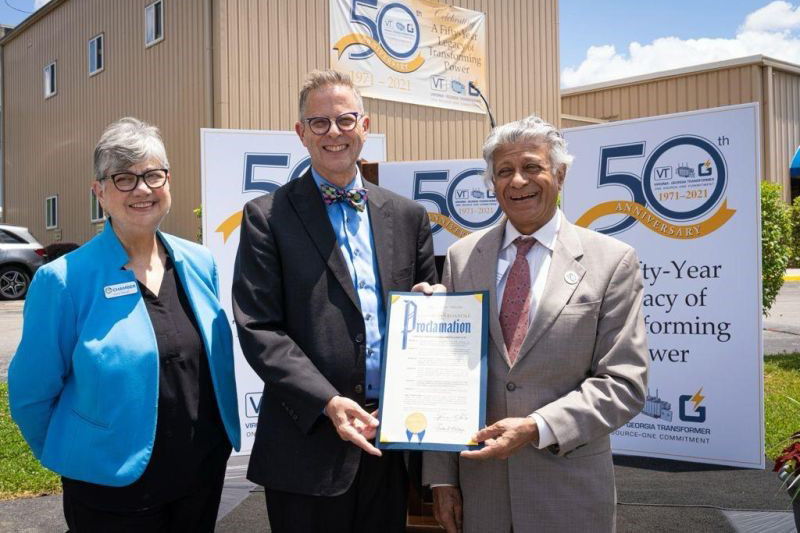 Prabhat Jain with Joyve Waugh and Councilman Joe Cobb proclaiming June 23 as Virginia Transformer Corporation day.