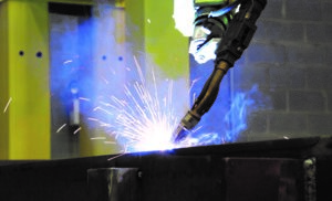 Welding a steel plate.