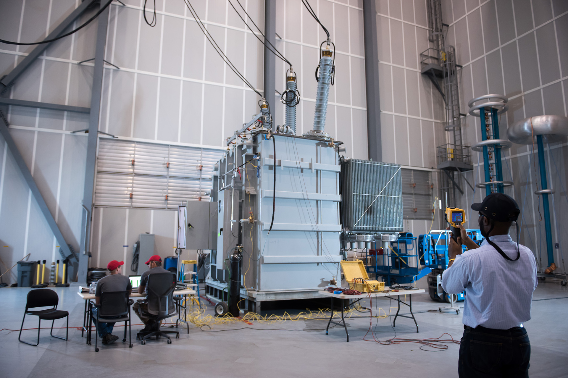 Witness testing facility with observers and test engineers.