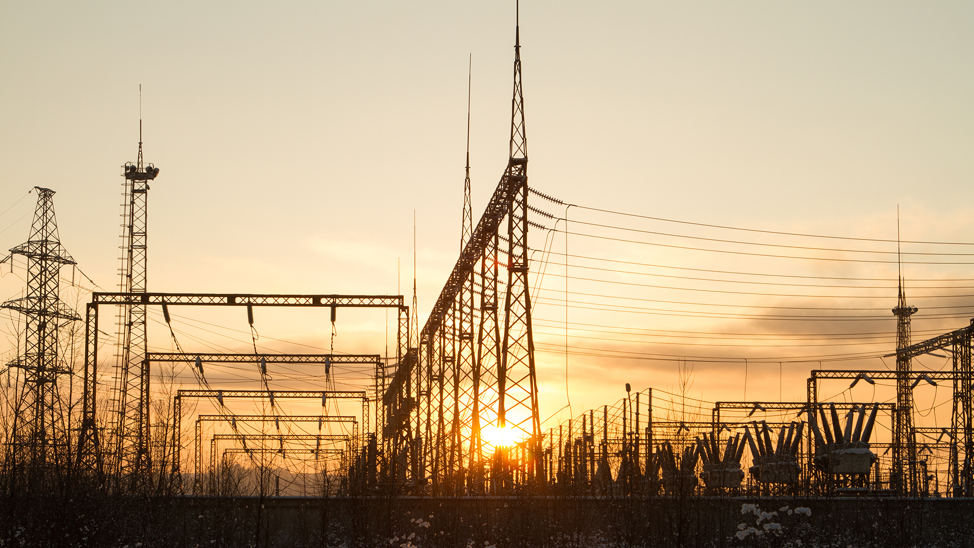 Power transformer station with towers and lines.